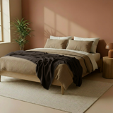 Blanket dark brown with horse stitch in a warm bedroom